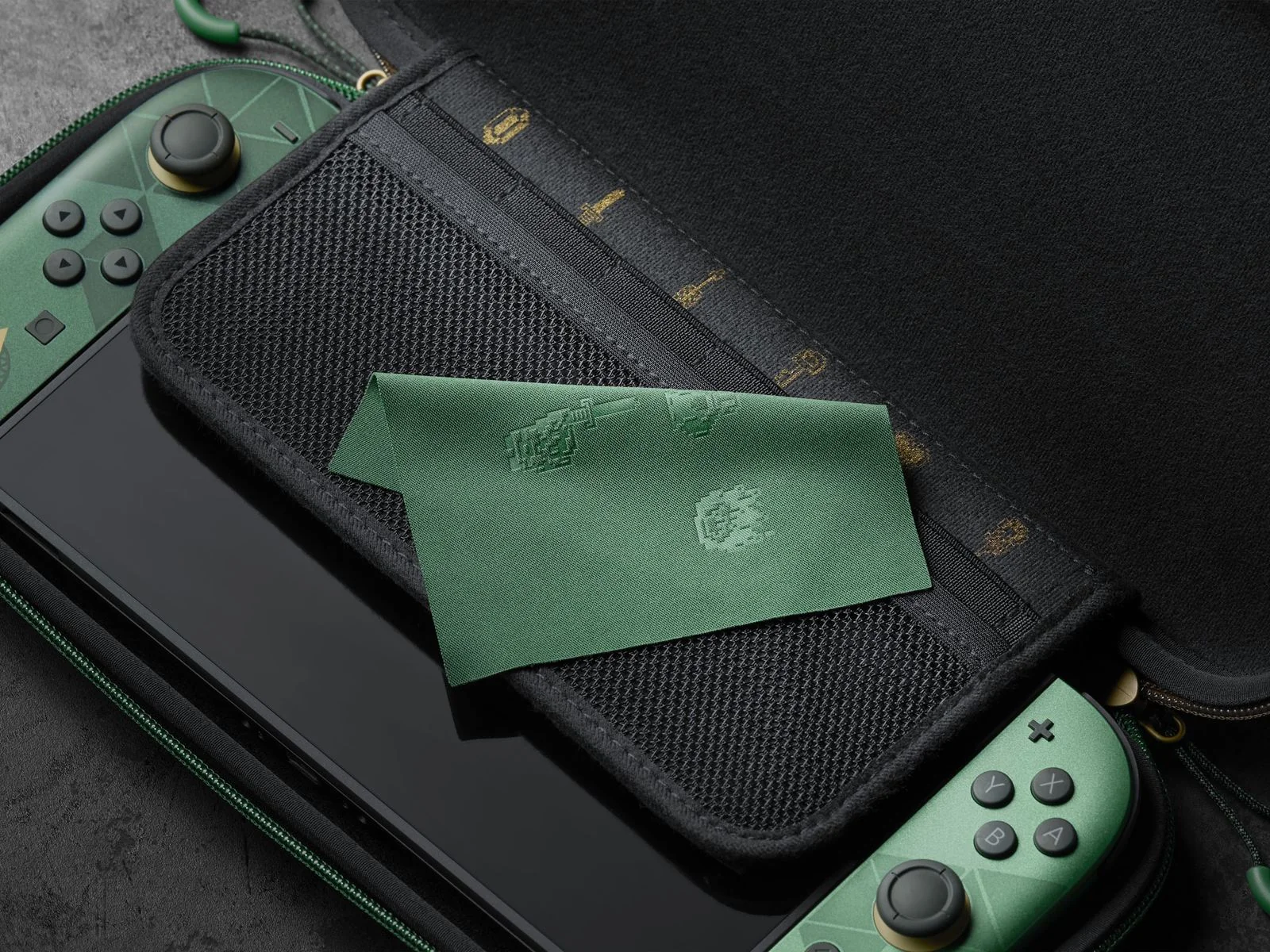 Zelda 40th Anniversary Switch 2 in its carrying case with a green 8-bit Link cloth