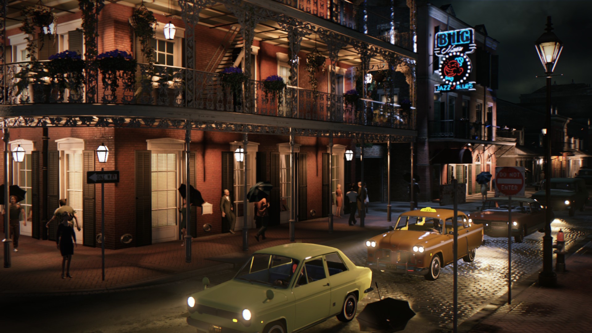 A rainy night street in New Bordeaux's French Ward with wrought-iron balconies, neon signs, and vintage cars in Mafia III: Definitive Edition