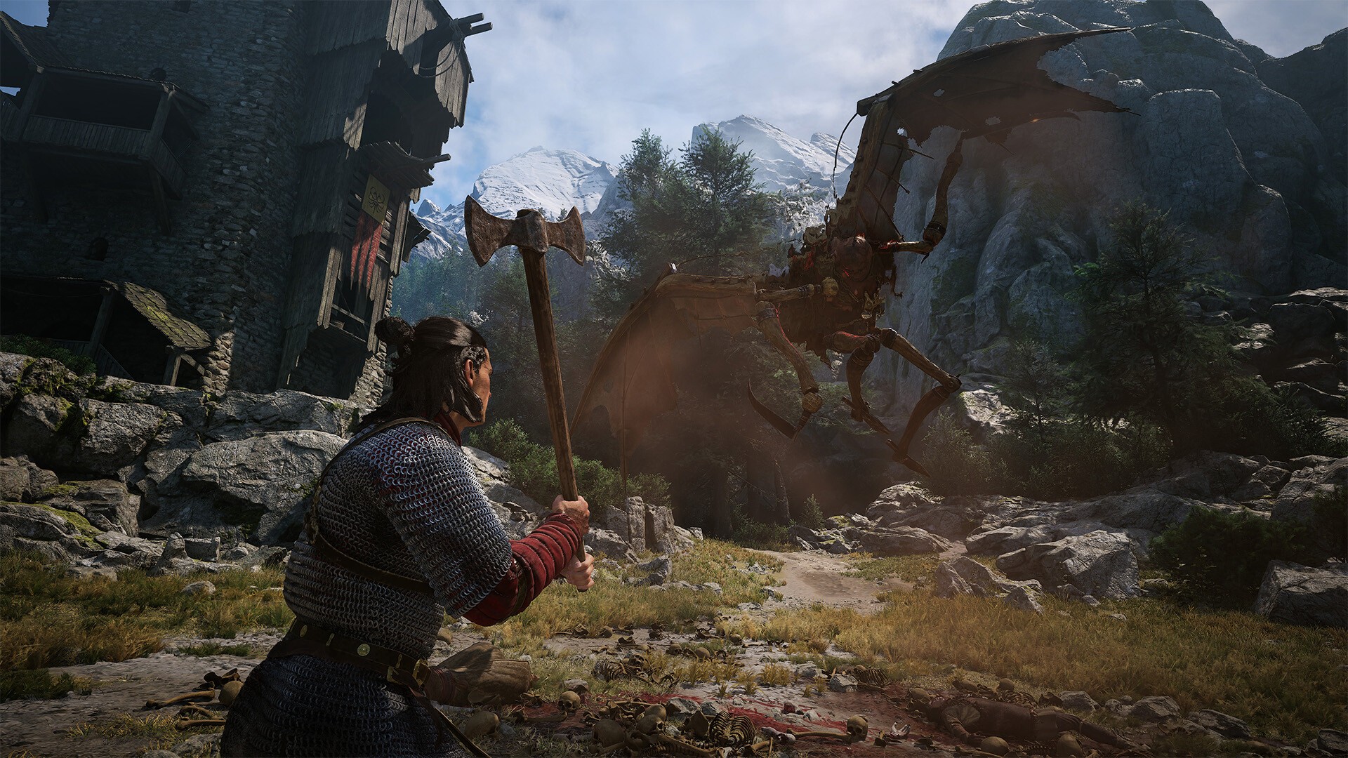Coen swings an axe at a creature in a mountain village in The Blood of Dawnwalker