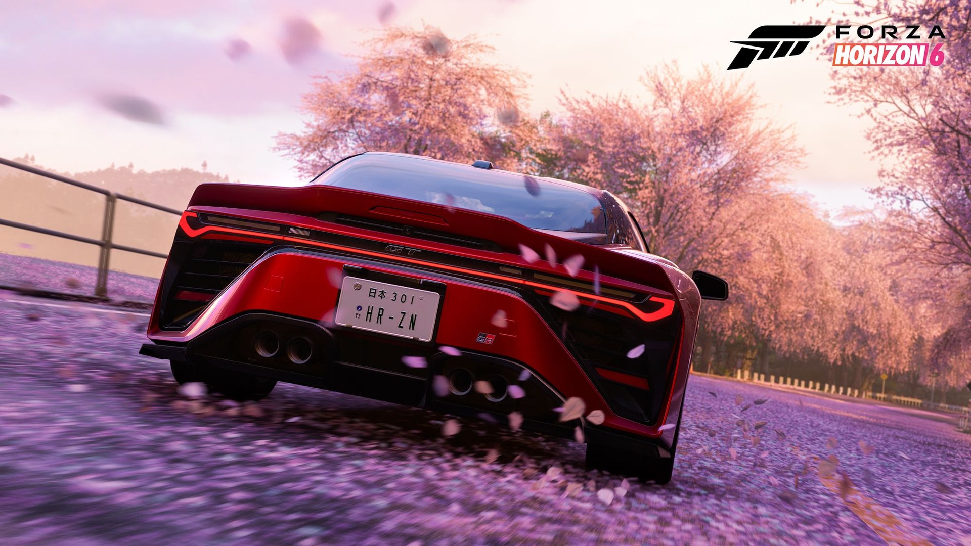 Forza Horizon 6 on PS5, a red sports car driving over cherry blossom petals on a spring road