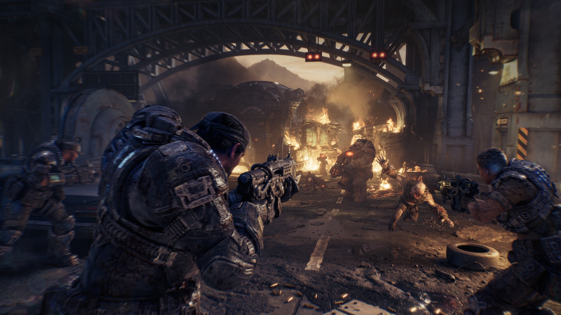 A Gears of War: E-Day squad fights through a burning street