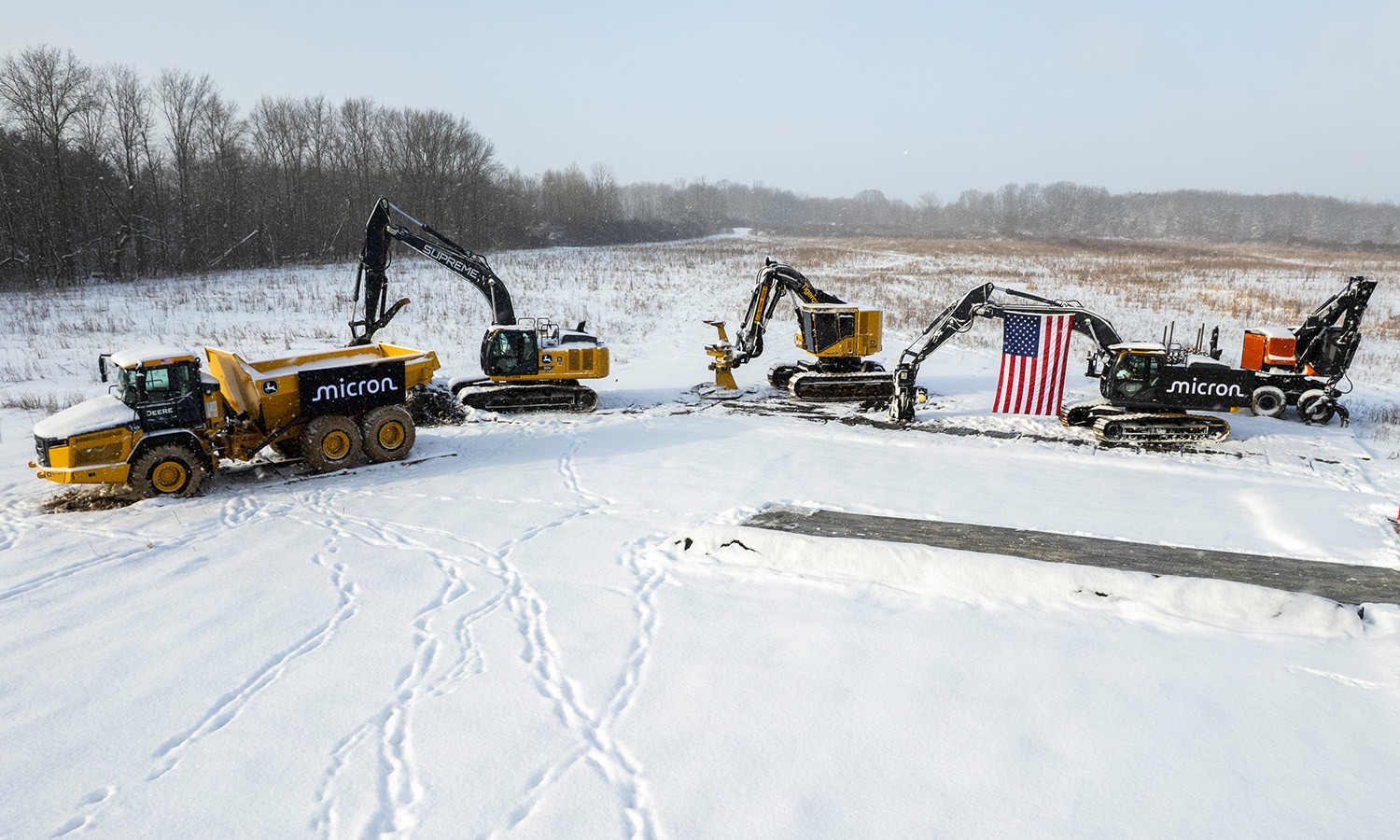 Construction equipment at the snowy site of Micron's New York megafab groundbreaking