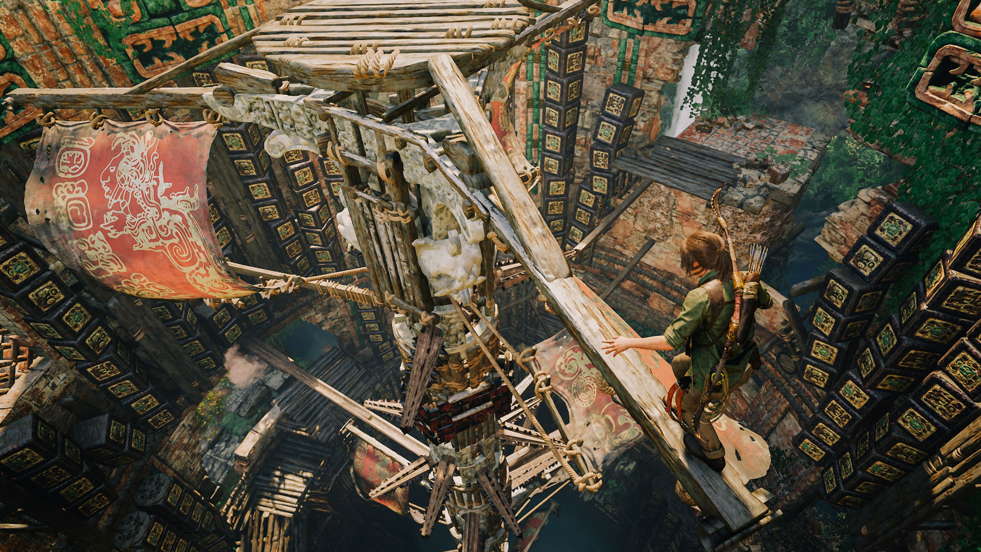 Lara Croft crossing a wooden beam inside a tomb in Shadow of the Tomb Raider