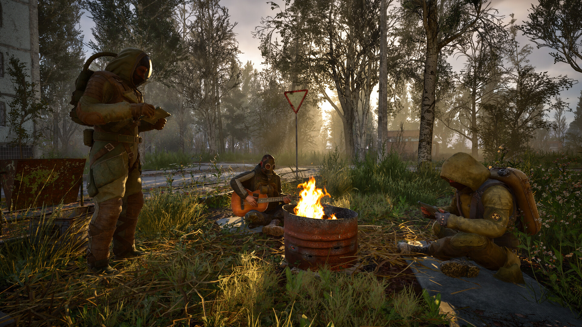 A squad of stalkers rests around a campfire in STALKER 2: Heart of Chornobyl
